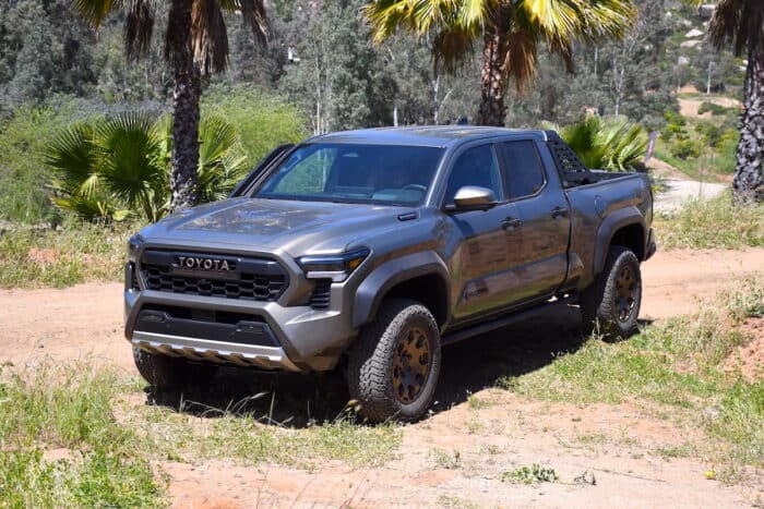 2024 Toyota Tacoma Hybrid i-Force-Max Trailhunter front parked on dirt