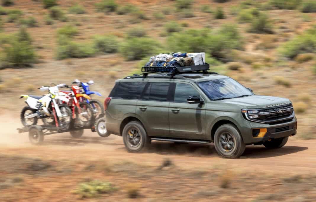 2025 Ford Expedition Tremor front view driving and towing dirtbikes