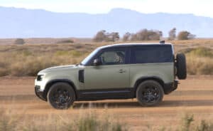 Land Rover Defender 90 sideview driving 2024