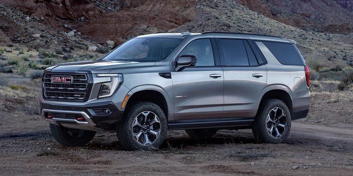 2026 GMC Yukon AT4 front parked on dirt road
