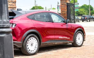 Red 2025 Ford Mustang Mach-E side rear