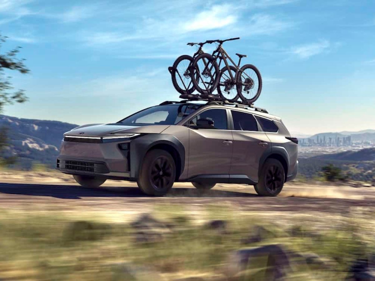 2026 Toyota bZ Woodland front driving with bike rack on roof