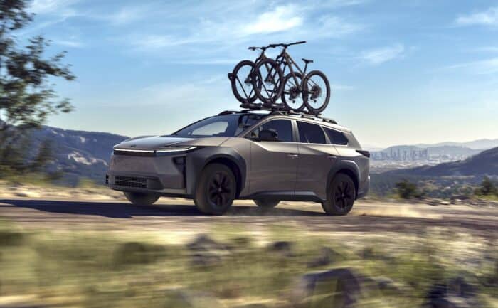 2026 Toyota bZ Woodland front driving with bike rack on roof