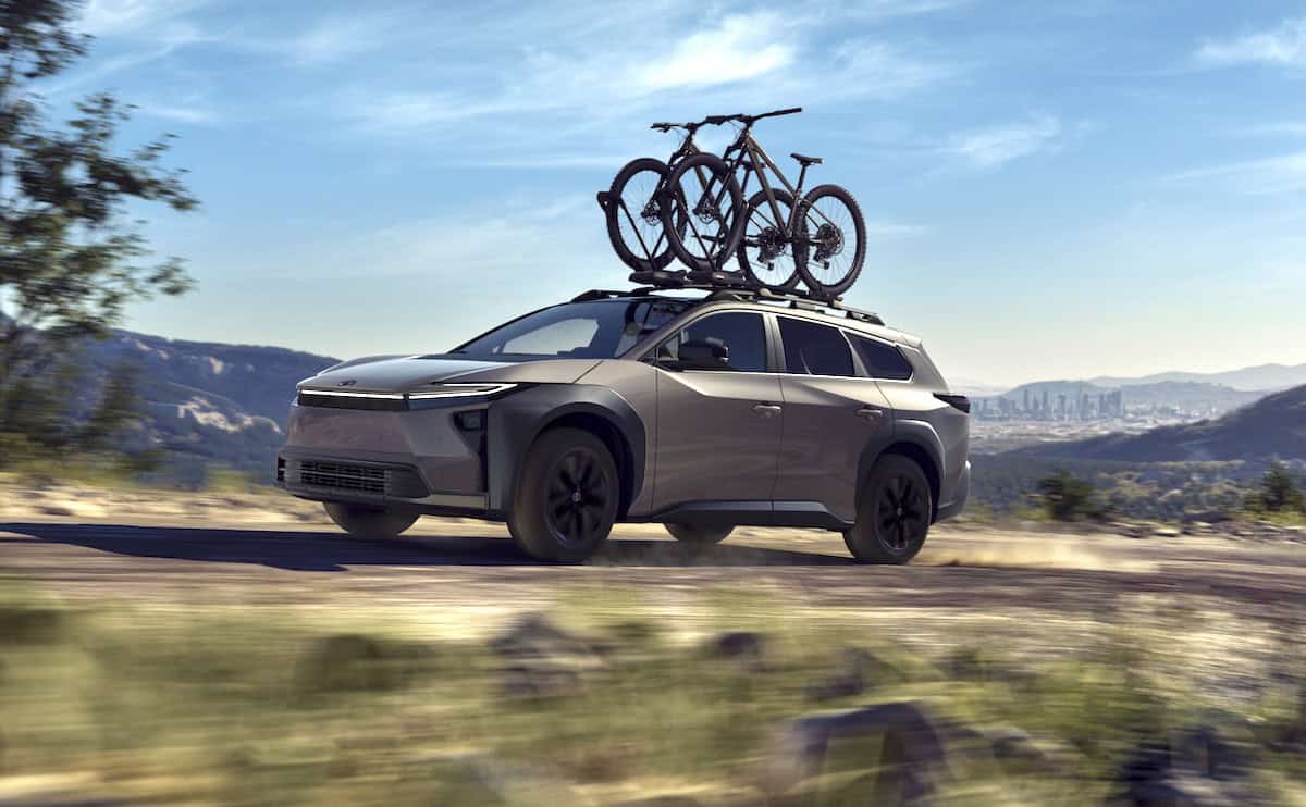 2026 Toyota bZ Woodland front driving with bike rack on roof
