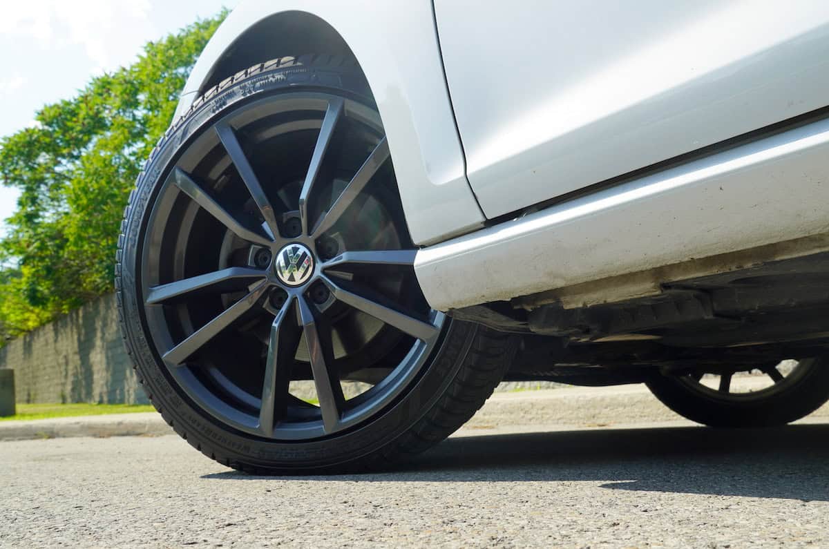 The Goodyear WeatherReady 2 wheel of a white car with black rims.