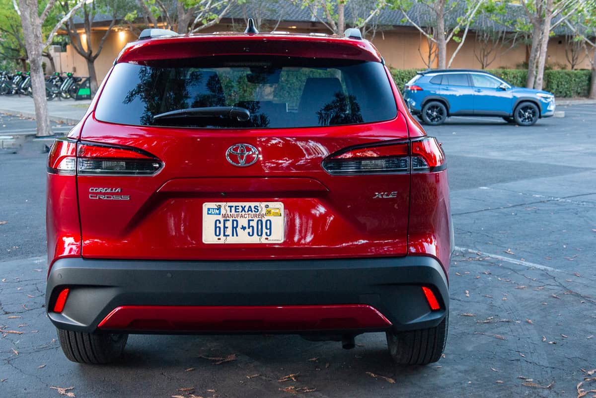 2026 Toyota Corolla Cross gas model rear and blue hybrid side