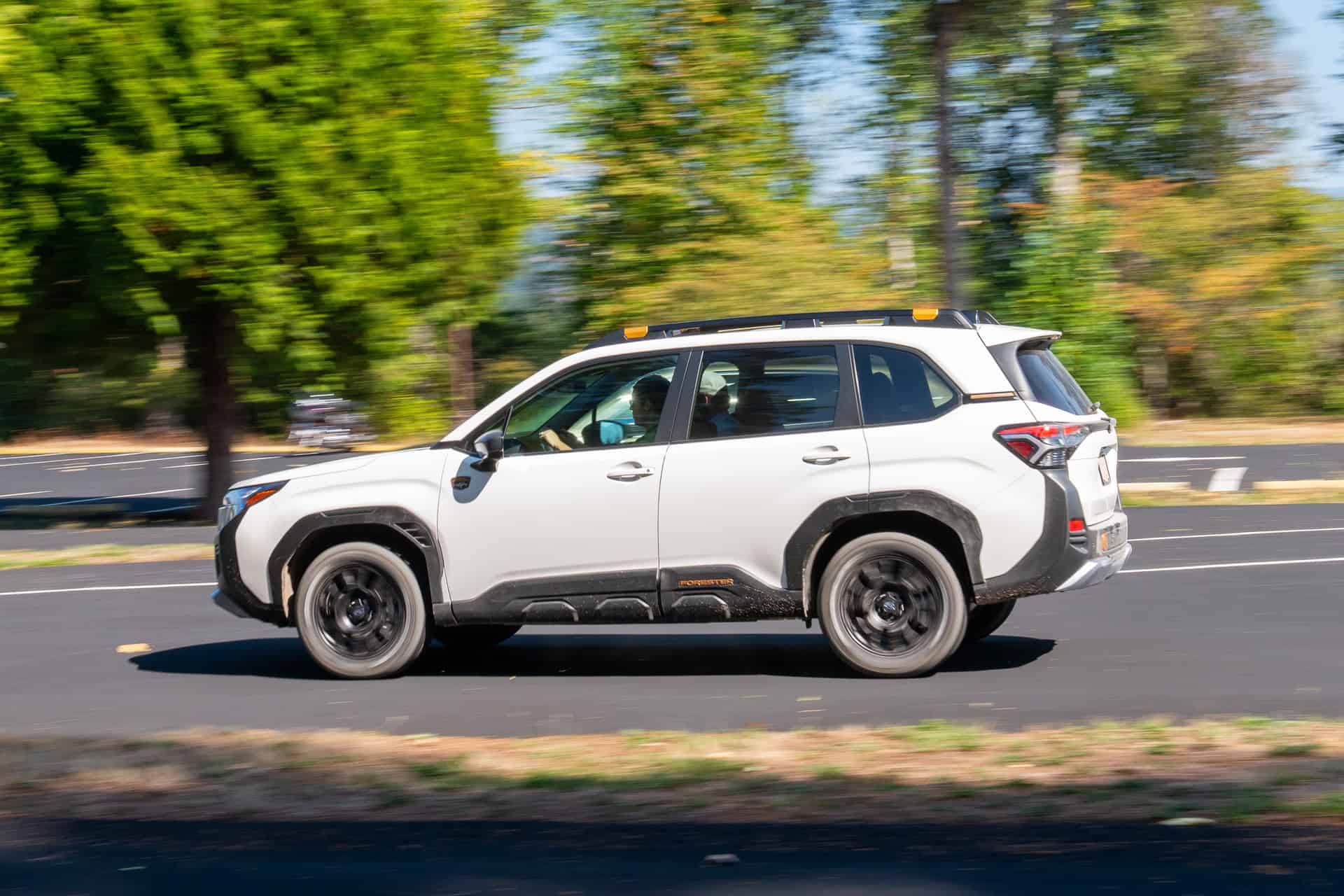 white 2026 Subaru Forester Wilderness side driving