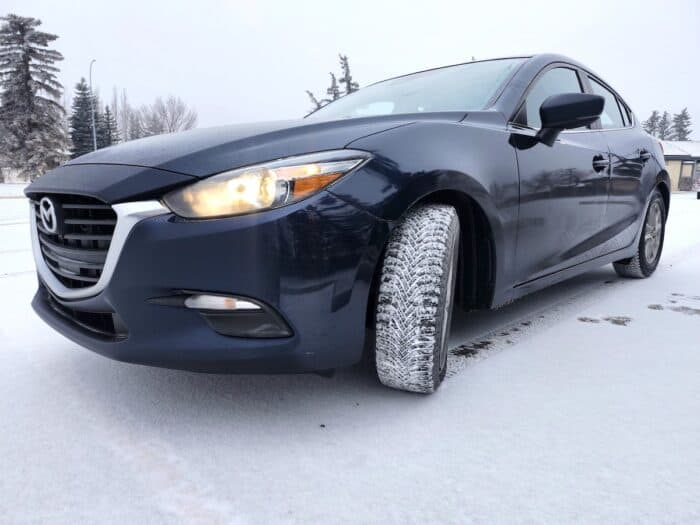 Goodyear Assurance WeatherReady 2 front tire in snow