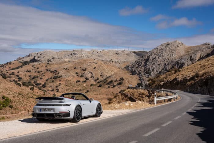 2026 Porsche 911 Turbo S T-Hybrid cabriolet rear on the road