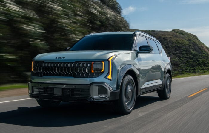 2027 Seltos HEV front driving on the road