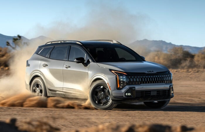 2026 Sportage front view kicking up dirt