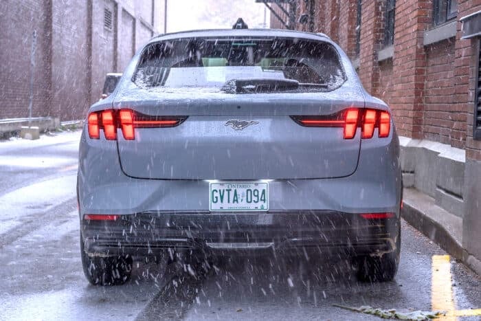 2025 Ford Mustang Mach-E Premium in the snow rear