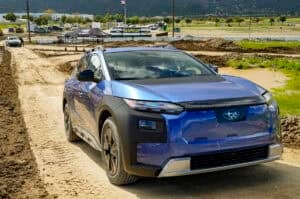 Blue 2026 Subaru Trailseeker EV front view off roading