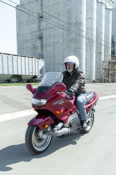 1993 Yamaha GTS1000 with rider on the road front view