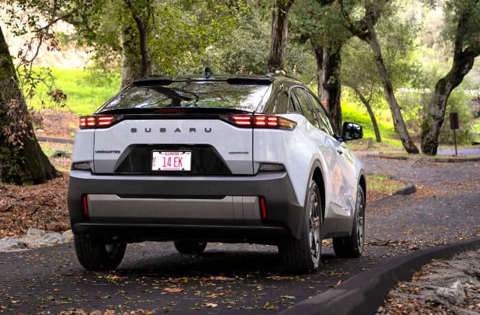 2026 Subaru Uncharted EV SUV rear view parked on the road
