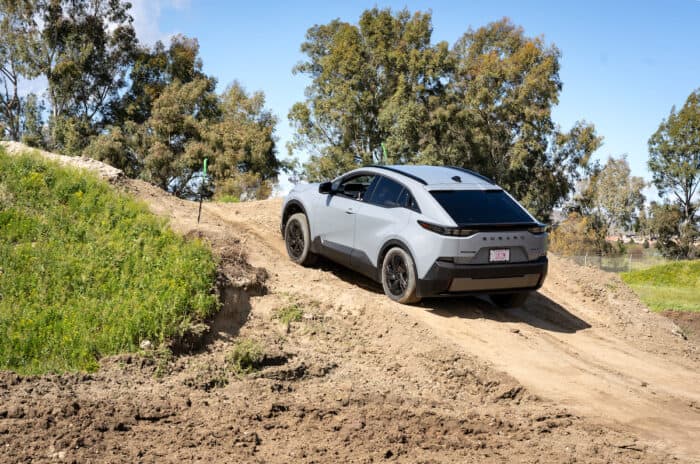 2026 Subaru Uncharted EV SUV rear shot off roading on dirt course