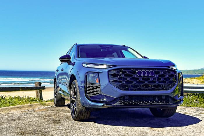 Blue 2026 Audi Q3 front view parked by the water