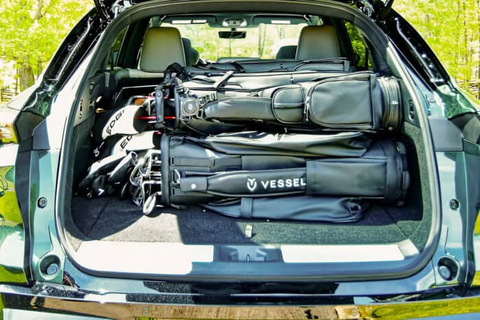 2027 Infiniti QX65 cargo showing 4 golf bags in trunk with door open