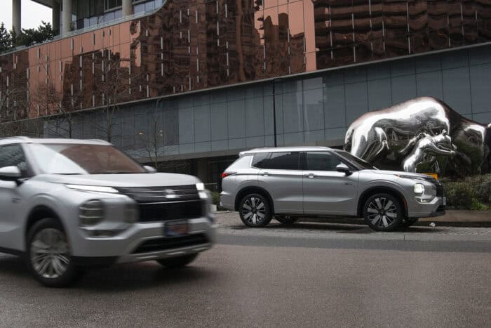 2026 Mitsubishi Outlander PHEV parked and driving side by side