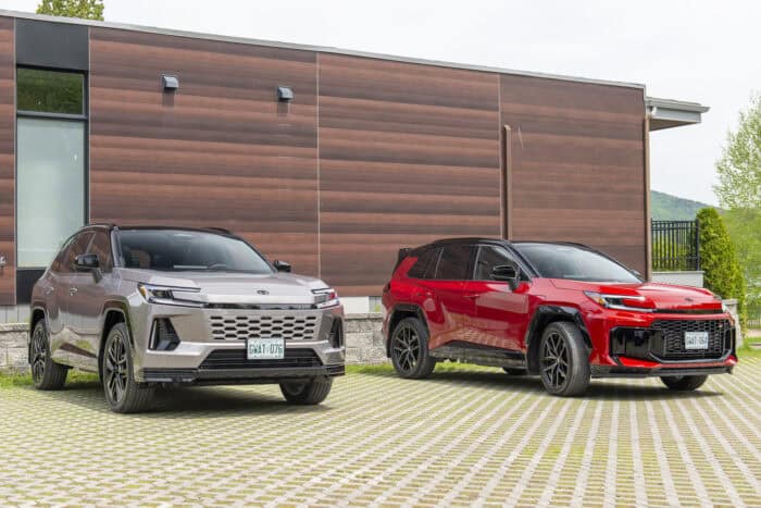 2026 RAV4 PHEV model next to red 2026 Toyota RAV4 GR Sport front views