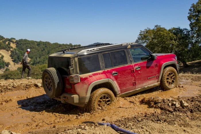 2026 Jeep Recon EV off roading through mud, rear view