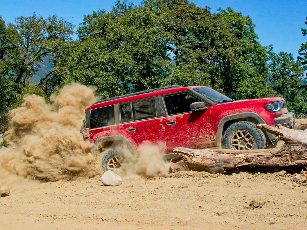 2026 Jeep Recon EV side view kicking up dirt