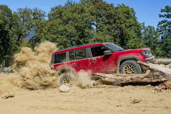 2026 Jeep Recon EV side view kicking up dirt