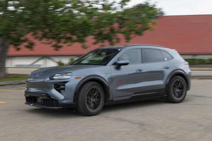 2026 Porsche Cayenne Electric front driving around corner